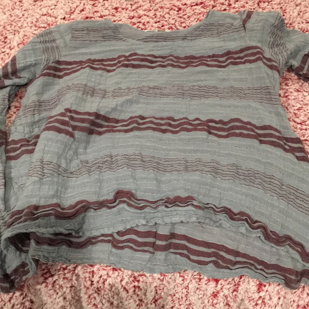 100% cotton top with quarter sleeves and pockets. Name of store is Spirithouse